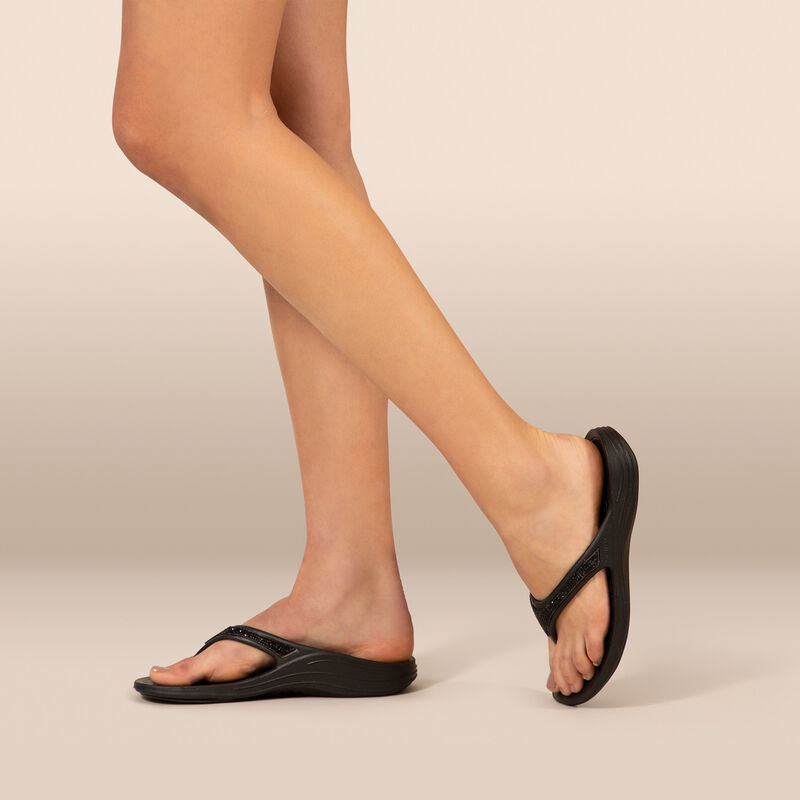 black orthotic flip flops on feet